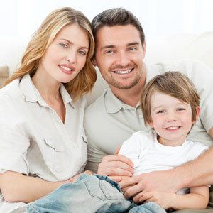 Couple with their son smiling