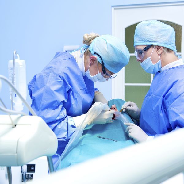 Patient having dental implant surgery