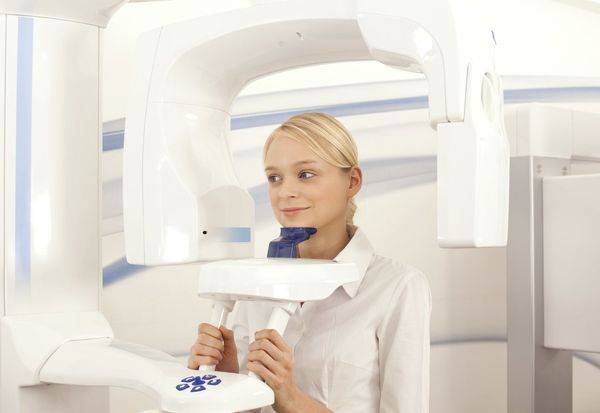 Patient undergoing ORTHOPHOS SL 3-D cone beam scan